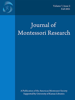 Blue journal cover with title of journal knocked out in white