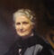 Oil painting of Maria Montessori holding a book